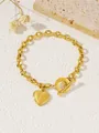 Vergulde hartvormige bedelarmband met de letter 'L' en OT-schakelsluiting - Hart Letter L / Goud