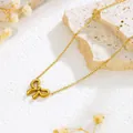 Elegant gold bow pendant necklace with a matte finish on a minimalist textured background - Gold O-Chain Bowknot Necklace (X1356)