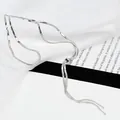 Detail of silver flat snake chain with adjustable ball slide and tassel design - Long / Steel