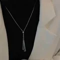 Silver geometric triangle fringe necklace with adjustable box chain on a model - Silver