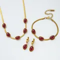 Macro detail of K18 gold snake chain necklace and red oval gemstone jewelry set - Dark Red Necklace Bracelet And Earrings Set