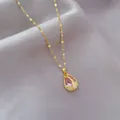 Elegant gold tulip necklace with pear-shaped pink crystal and zircon on purple satin - Pendant With Chain / Pink Tulip