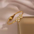 Luxurious gold four-leaf clover open bangle with sparkling cubic zirconia accents - Full Rhinestone Clover Style