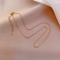 Elegant gold link chain necklace with lobster clasp and extension on pink silk fabric - Link Chain (Chain Only) / Gold