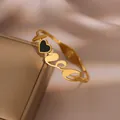 Elegant gold-plated open bangle with 'Love' script and a black heart accent - Heart LOVE Style