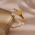 Elegant gold plated snake bracelet with sparkling white cubic zirconia inlays - Snake Shape Style