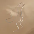 Detail of silver snake bone chain necklace with adjustable sliding bead on satin fabric - Silver Long