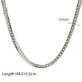 Detail view of 0.65cm wide stainless steel curb chain with size labels and dimensions - Silver