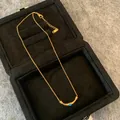 Golden titanium steel necklace with blue stone inlay in a velvet jewelry box - Crescent Moon Titanium Steel Necklace