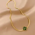 Golden titanium steel four-leaf clover necklace with green zircon on silk background - Four-leaf Flower Heart
