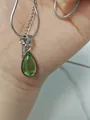 Detail shot of the teardrop green gemstone pendant on a silver snake chain necklace - Titanium Steel Necklace / Green Water Drop (Silver)