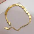 Elegant gold snake chain bracelet featuring engraved LOVE square beads and K18 tag - Gold