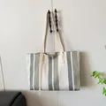 Large vertical stripe canvas tote bag with long shoulder straps for stylish commuting - White