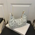 Chic beige shoulder bag featuring black bow prints and a premium pearl chain strap - Green