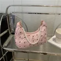Pink pleated hobo bag with black bow prints and white pearl handle strap - Pink