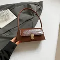 Retro brown underarm bag with crocodile embossed flap and golden metallic clasp - Brown