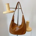 Chic brown faux leather crescent hobo bag with wide strap for stylish women - Brown