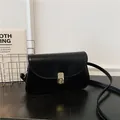 Minimalist black PU leather saddle bag with a golden twist lock for daily casual wear - Black