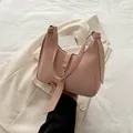Chic Morandi pink matte leather crescent shoulder bag with golden metallic buckle - Pink