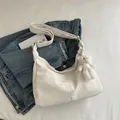 Creamy white PU leather tote bag with soft texture and a cute plush bear charm - With Pendant / White