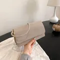 Elegant champagne gold envelope evening bag with fine rhinestones and metallic strap - Gold