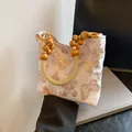 Roze okseltas met vlinderprint en creatieve handgreep van grote houten kralen voor dames - Roze