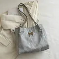 Silver grey velvet tote bag with metallic butterfly buckle and plush eye charm - With Ornament / Gray