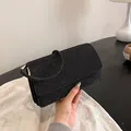 Minimalist black glitter evening clutch bag with round top handle and golden hardware - Black