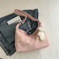 Light pink hobo tote bag with glossy pleated texture and cute white plush bear pendant - With Pendant / Pink