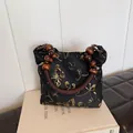 Vintage black satin shoulder bag with gold butterfly print and wooden bead handle - Black