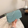 Elegant light blue rhinestone evening bag with circular handle and flap closure - Blue