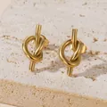Minimalist gold knot stud earrings for women shown on a natural stone textured background - Stud Earrings (1 Pair) / Gold