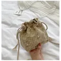 Straw drawstring bucket bag with pink flower embroidery and thick rope shoulder strap - Khaki