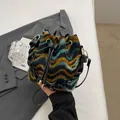 Bohemian knit bucket bag with colorful wavy patterns and leather drawstring closure - With Ornament / Black