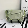 Japanese style nylon messenger bag in light green with buckle closure and fashion label - Green