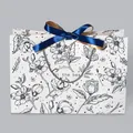 Vintage floral paper gift bag with black magnolia print and blue ribbon bow decoration - Floral Style