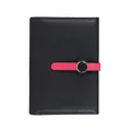 Minimalist black pebble grain leather passport wallet with stylish pink contrast clasp - Black