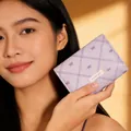 Detail of lavender trifold wallet with bow prints, Z-stitch finish and sweet girl label - Light Purple