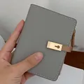 Short grey lychee pattern PU leather wallet with golden keyhole lock and side zipper - Gray