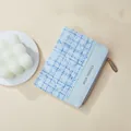 Compact blue tweed wallet for women with golden zipper and brand logo text - Blue