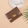 Brown trifold women's wallet with gold twist lock and glitter detail on smooth PU leather - Coffee