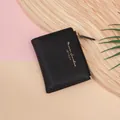 Short black crocodile texture wallet for women with golden zipper and lettering - Black