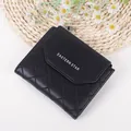 Black quilted faux leather tri-fold wallet for women with zipper pocket and snap closure - Black