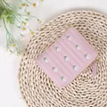 Short pink faux leather wallet featuring cute white daisy embroidery and gold zipper - Pink