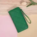 Women's long green quilted wallet with zipper closure and wristlet strap - Green