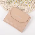 Short quilted trifold purse in beige faux leather with elegant silver buckle and logo - Khaki