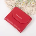 Quilted red trifold faux leather wallet with snap closure and silver zipper detail - Red