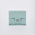 Quilted mint green wallet with classic diamond pattern and silver metallic twist lock - Green