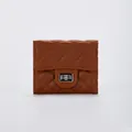 Brown quilted leather folding wallet for women featuring a silver metallic twist lock - Brown