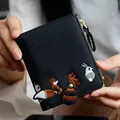 Short black bifold wallet with fox embroidery and pebble leather texture for women - Black